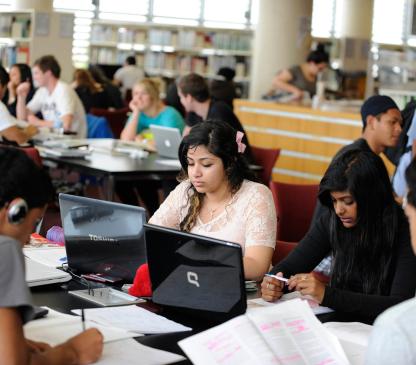 students sitting in a library