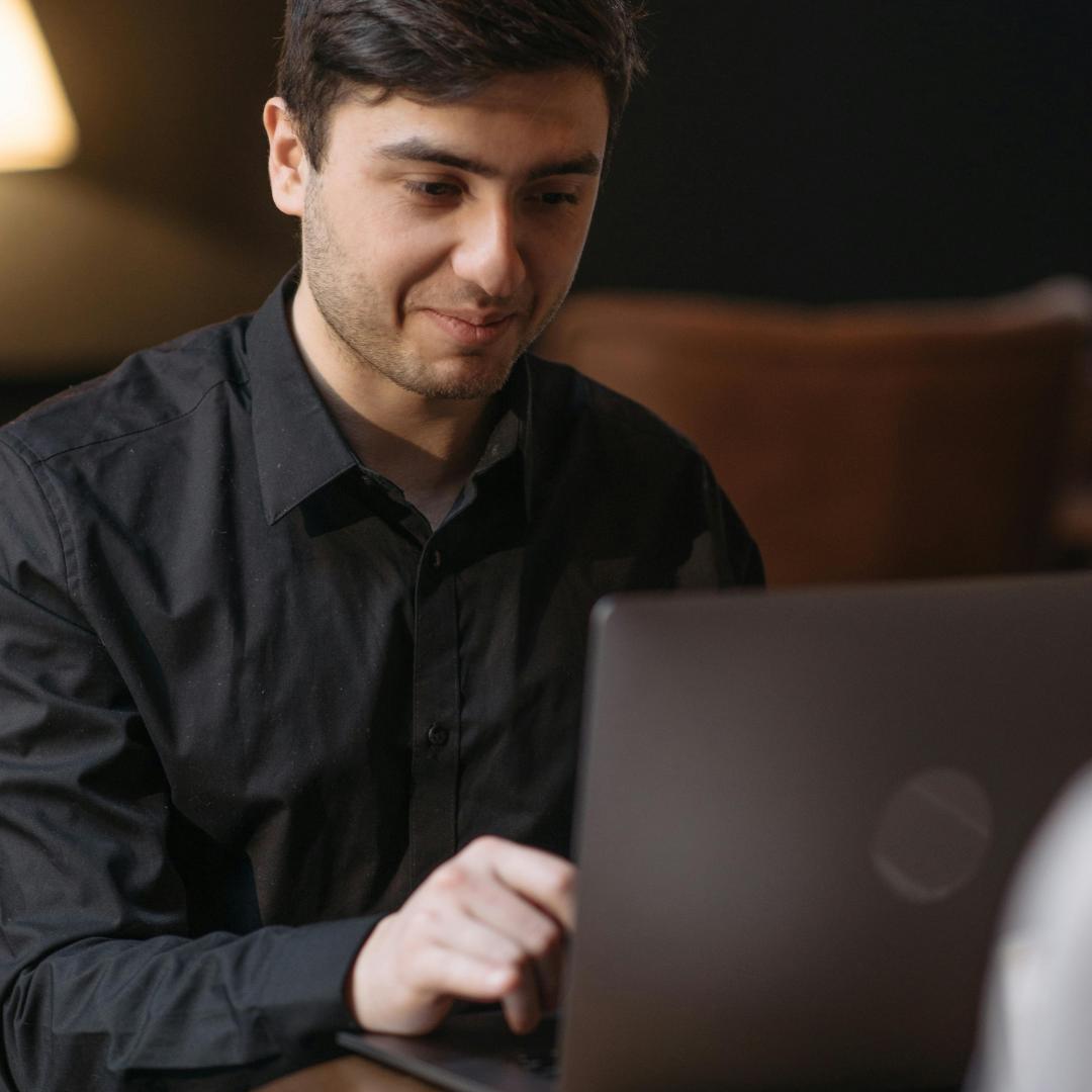 man looking at laptop